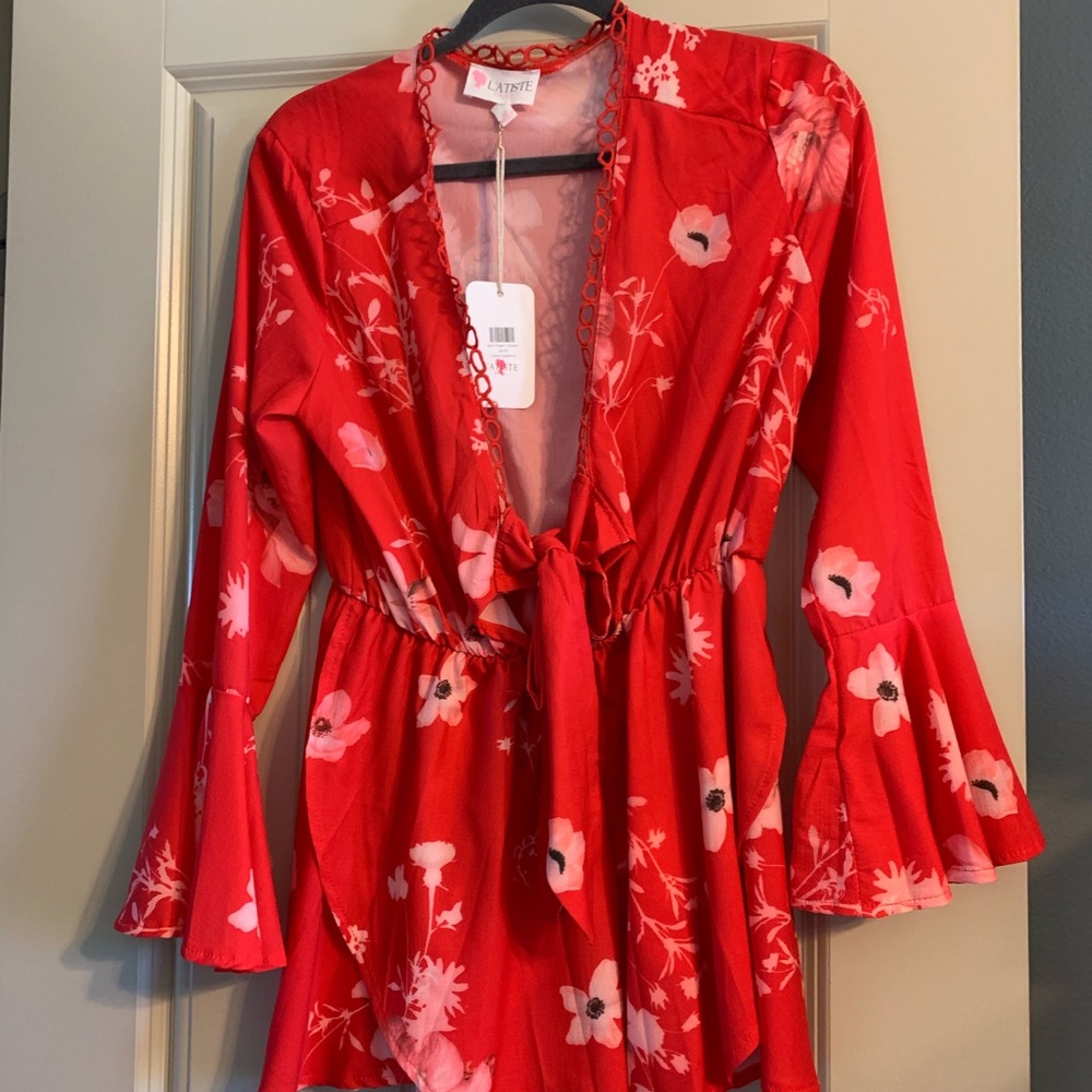 New, with tags. Super cute romper. Size small.